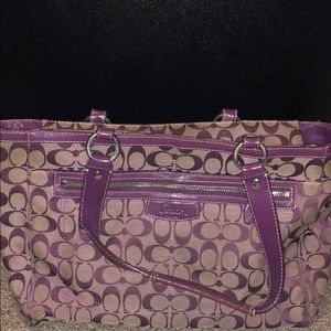 Purple and tan Coach pocketbook.